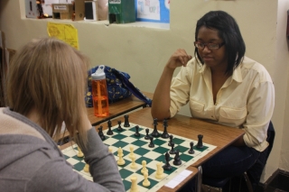 Juniors Allie Martin and Maggie Sproston enjoy a game of chess at a recent meeting. Photo by Maria Velasquez.