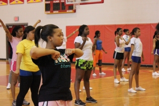 Clarke Central High School students participate in a clinic to prepare them for cheerleading try-outs.