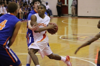 CCHS junior guard Jaquan Dowdy beats CSHS senior forward Sam Flexner off the dribble in a rivalry game between the Gladiators and the Jaguars at CCHS on Jan. 19. Dowdy racked up 15 points and Flexner contributed with seven in CCHS's win against CSHS with a final score of 78-59.